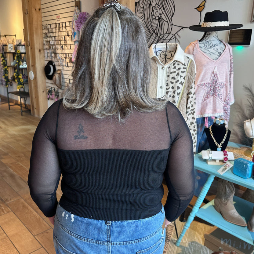Back view of the Sheer Aura sweetheart top in black, showing the sheer mesh detailing on model at Gypsy Spirit Boutique.